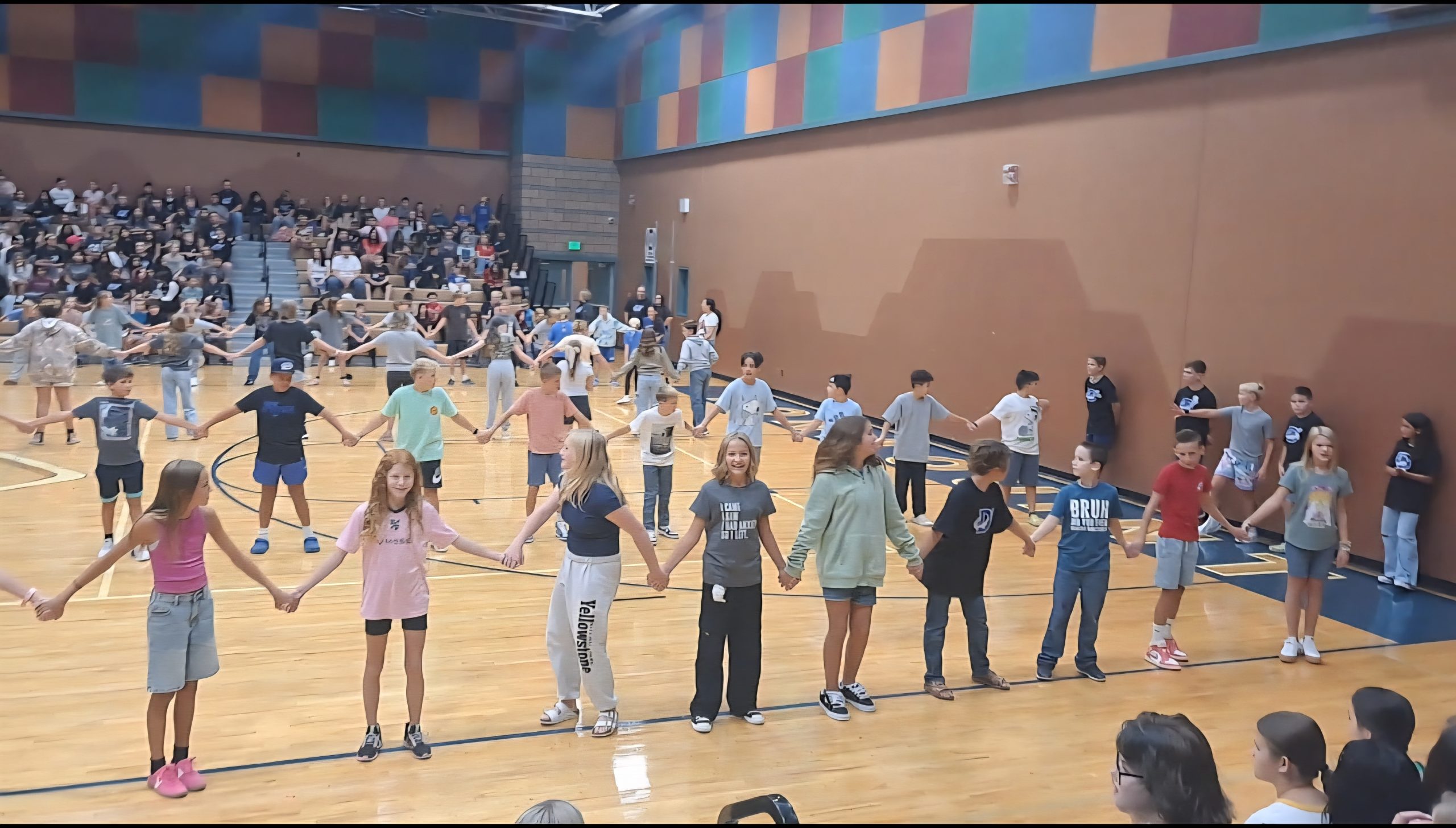 Students participating in a challenge at DIS 1st assembly